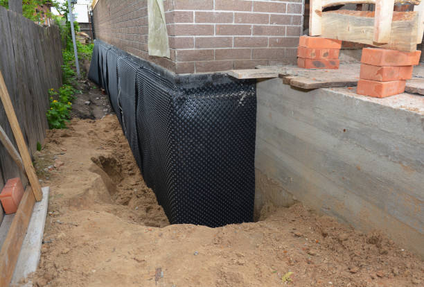 Happy homeowners after waterproofing job in Morenci